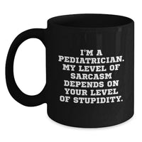 Load image into Gallery viewer, Funny Gifts from Friends and Family for a Pediatrician - 'I'm A Pediatrician. My Level Of Sarcasm Depends On Your Level Of Stupidity.' Black Coffee Mug - Main