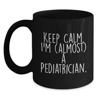 Load image into Gallery viewer, Funny Pediatrician Gifts for Graduation - Gifts from Friends to Family - 'Keep Calm, I'm (almost) A Pediatrician.' Black Coffee Mug - Main