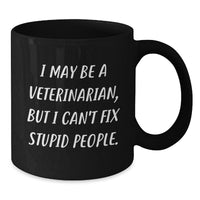Load image into Gallery viewer, Gifts from Men for Veterinarian Christmas Unique Fun Black Coffee Mug - I May Be A Veterinarian, But I Cant Fix Stupid People. - Additional
