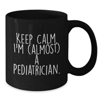 Load image into Gallery viewer, Funny Pediatrician Gifts for Graduation - Gifts from Friends to Family - 'Keep Calm, I'm (almost) A Pediatrician.' Black Coffee Mug - Additional