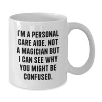 Load image into Gallery viewer, Funny Graduation Gifts from Personal Care Aide Enthusiasts, White Coffee Mug for Personal Care Aide, 'I'm A Personal Care Aide. Not A Magician...' - Additional