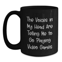 Load image into Gallery viewer, Funny Playing Video Games Quotes Gift for Men - Birthday Unique Gifts from Friends - Black Coffee Mug for Gamers, 'The Voices In My Head Are Telling Me To Go Play' - Main