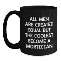Load image into Gallery viewer, Mortician Coffee Mug, Funny Graduation Gift from Friends, &#39;All Men Are Created Equal But The Coolest Become A Mortician&#39;, Black 11oz or 15oz Microwave and Dishwasher Safe - Main
