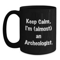 Load image into Gallery viewer, Funny Archeologist Gifts from Family to Daughter Graduation Unique Gifts - Keep Calm, I'm (almost) An Archeologist Black Coffee Mug for Men Women Friends - Main