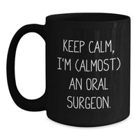 Load image into Gallery viewer, Oral Surgeon Funny Graduation Unique Gifts - Keep Calm, I'm (almost) An Oral Surgeon. Inspired Black Coffee Mug for Friends and Family. - Main