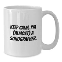 Load image into Gallery viewer, Funny Sonographer Gifts from Friends - White Coffee Mug for Graduation - 'Keep Calm, I'm (almost) A Sonographer' Inspirational Quotes - Additional