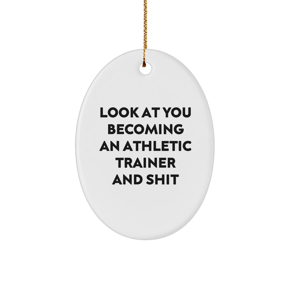 Funny Christmas Unique Gift for Athletic Trainer Friends - Oval Ornament, Look At You Becoming An Athletic Trainer And Shit, Gifts from Men to Women Family - Image 1